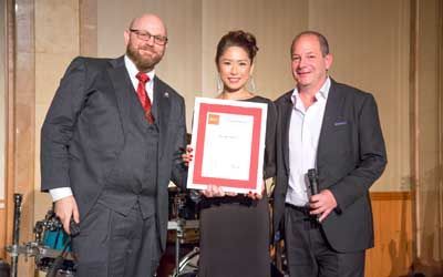 ACCJ Leader of the Year, Nao Geisler on stage receiving her award at the 2017 Champagne Ball.