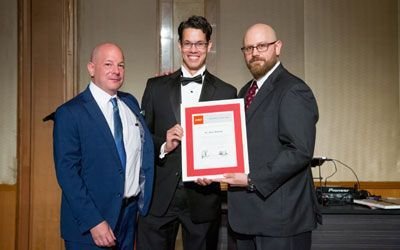 ACCJ Volunteer of the Year, Mark Hosang receiving his award on stage