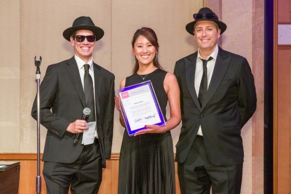 Natsuko Gomi - ACCJ Chubu Volunteer of the Year - receiving her award on stage