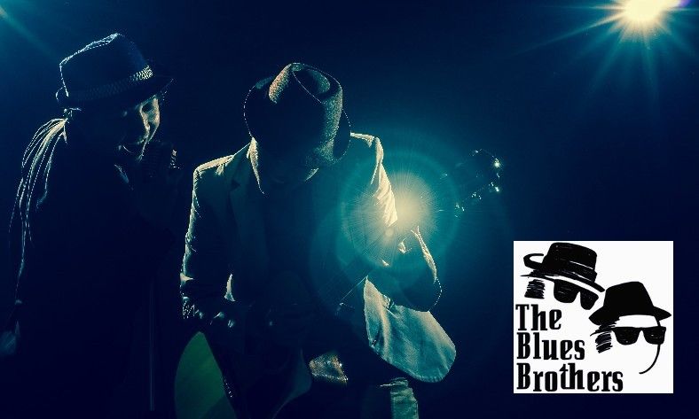 A poster for the blues brothers shows two men playing guitars