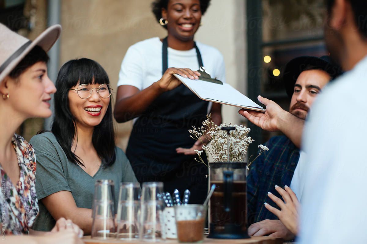 Friends dining together near Park Center at Seven Oaks luxury apartments