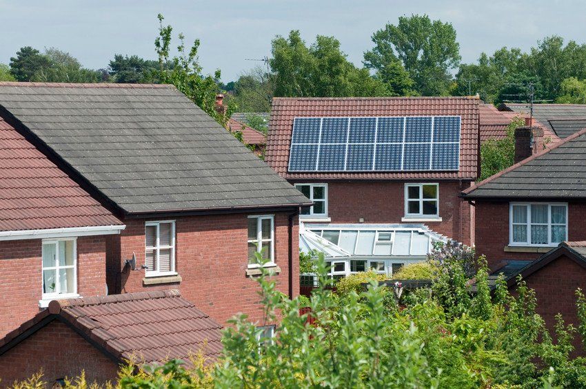 Electrical solar panels on the roof of a modern sub-urban house