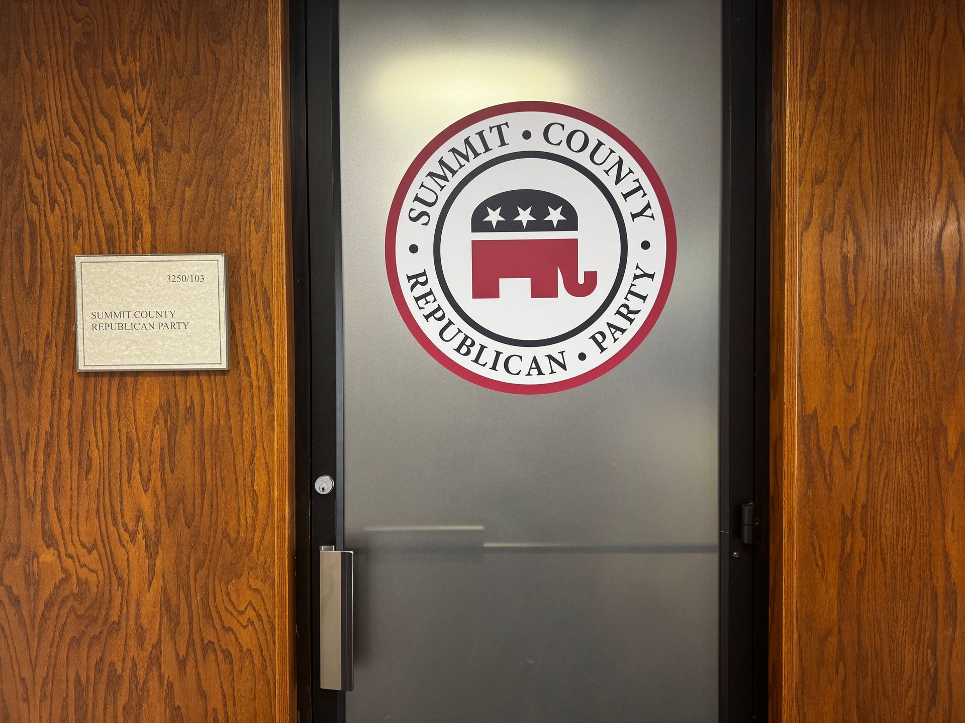Door to Summit County Republican Party office, with logo of an elephant, stars, and text.