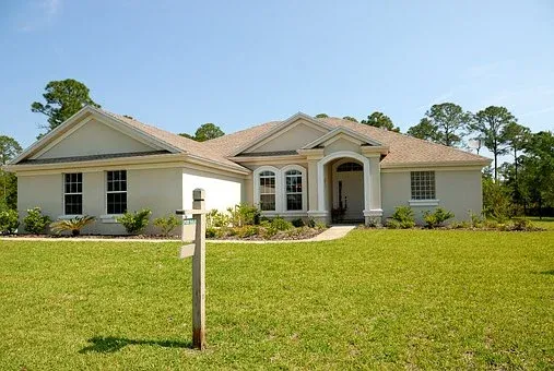 house with green field