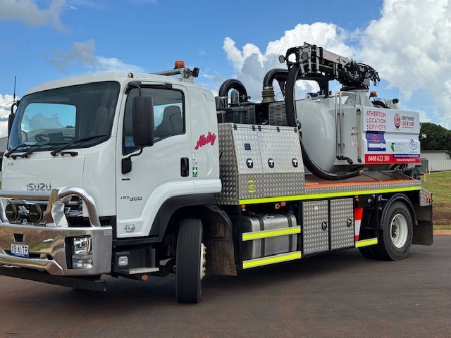 White Isuzu Truck With Industrial Equipment — Atherton Location Services In Atherton, QLD