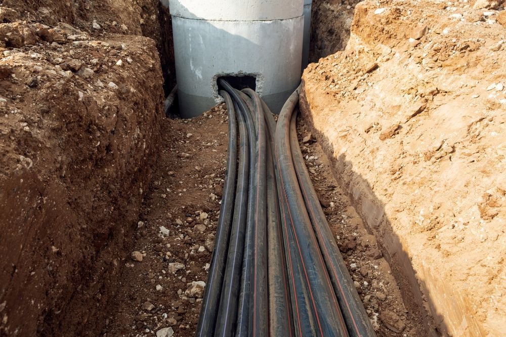 A Bunch Of Wires Are Coming Out Of A Hole In The Ground — Atherton Location Services In Atherton, QLD