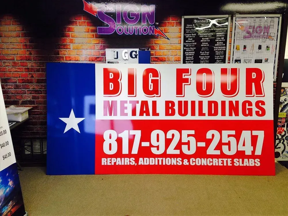 A large, rectangular sign with the Texas flag design, reading 