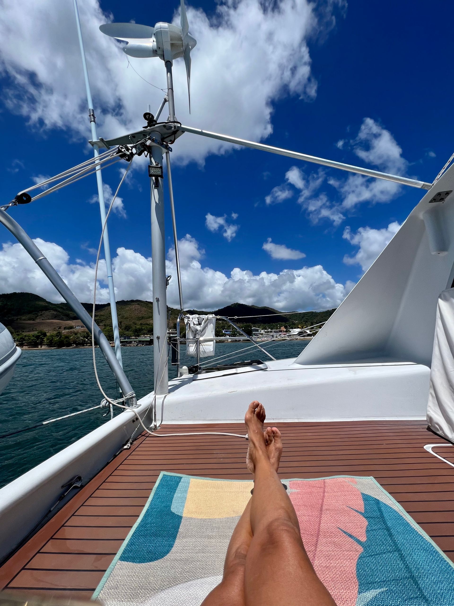 Chris White performance sailing catamaran Atlantic 48 ZEN private listing Rhode Island aft deck facing port hull with D400 wind generator