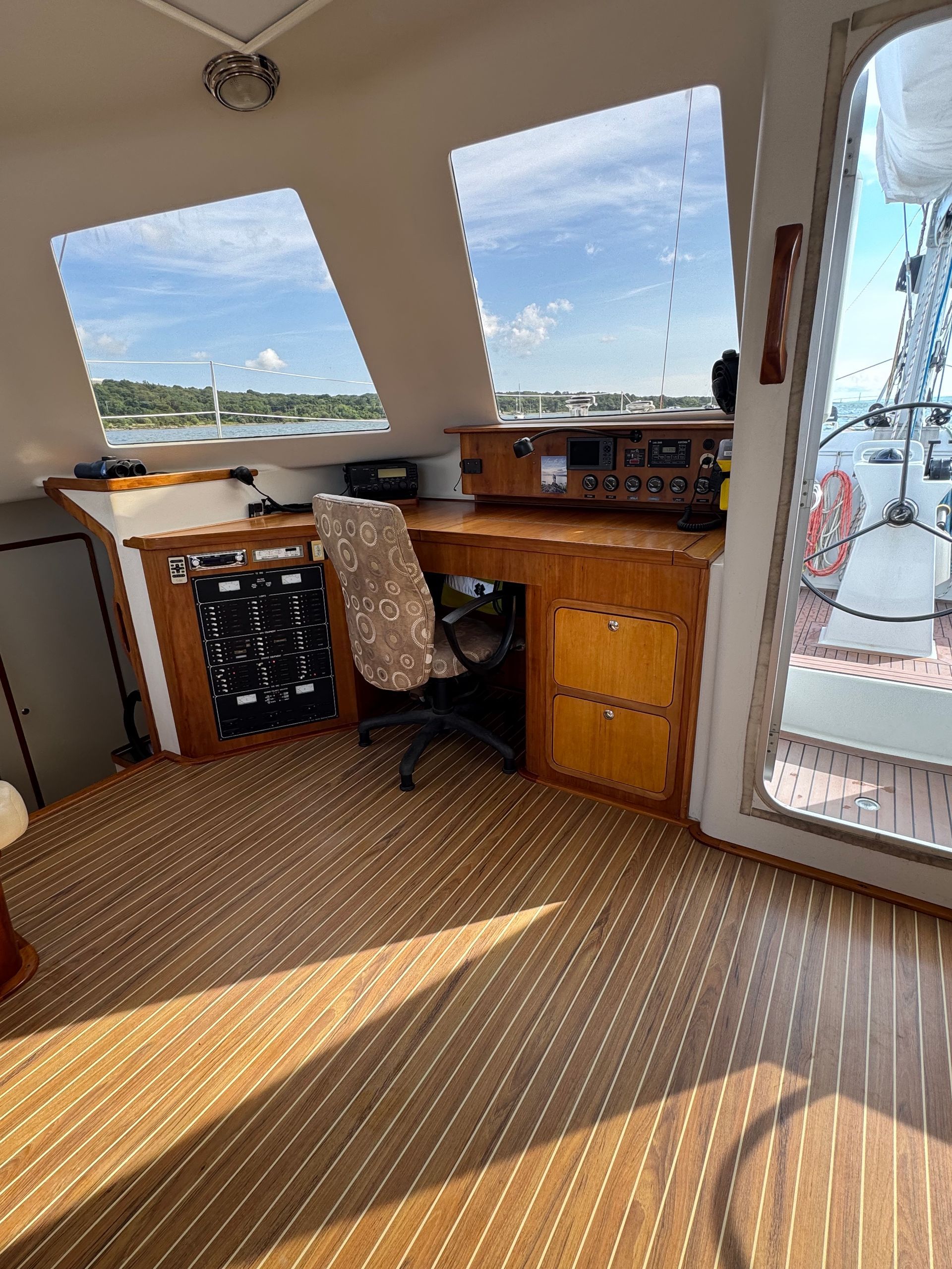 Chris White performance sailing catamaran private listing ZEN navigation desk in main salon