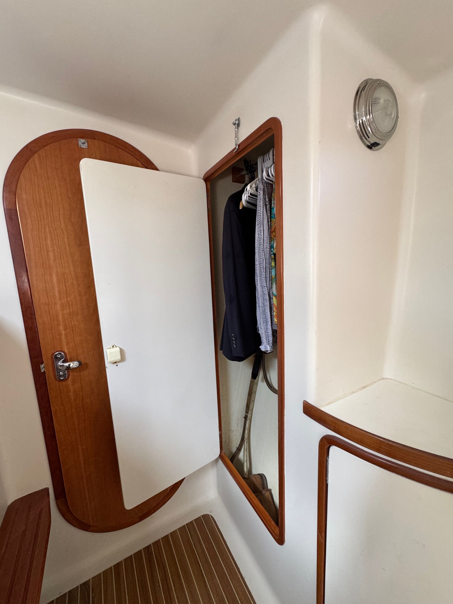 Chris White performance sailing catamaran Atlantic 48 ZEN private listing Rhode Island queen midship cabin hanging locker and access