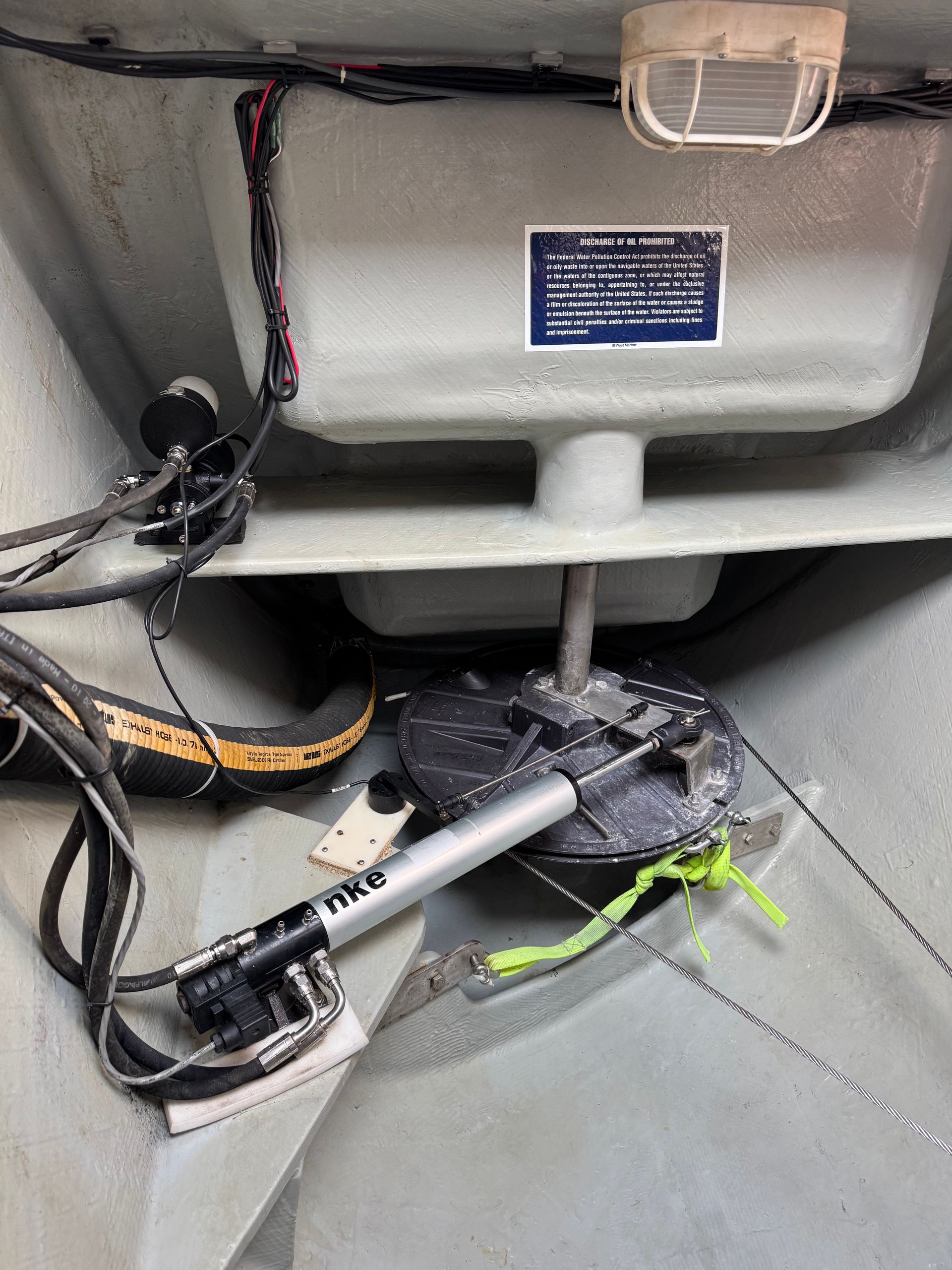 Chris White performance sailing catamaran Atlantic 48 ZEN private listing Rhode Island starboard engine room with NKE autopilot and cable steering system