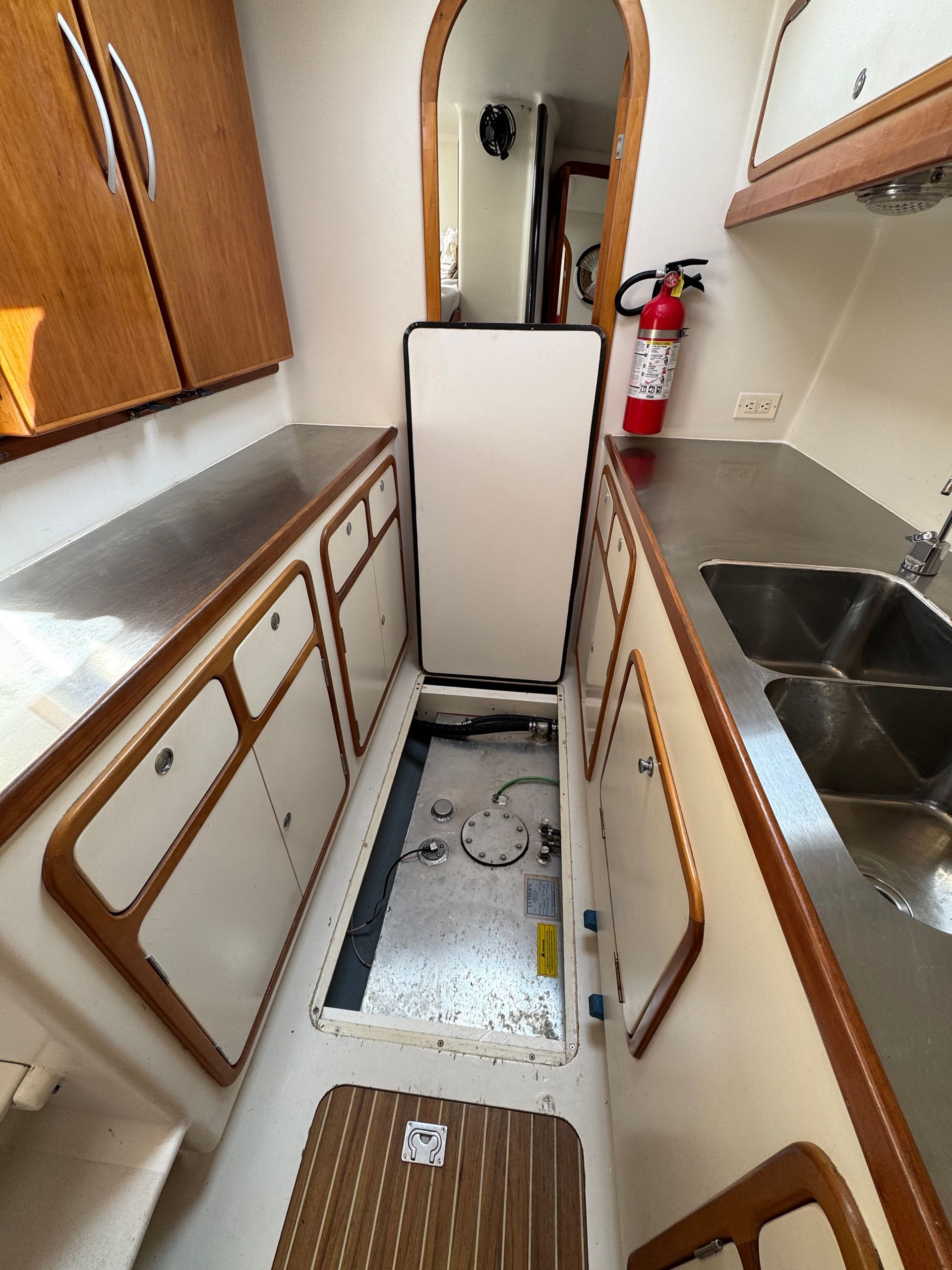 Chris White performance sailing catamaran Atlantic 48 ZEN private listing Rhode Island starboard galley, stainless steel,  ample countertops, double sink, large storage capacity - custom fuel tankage