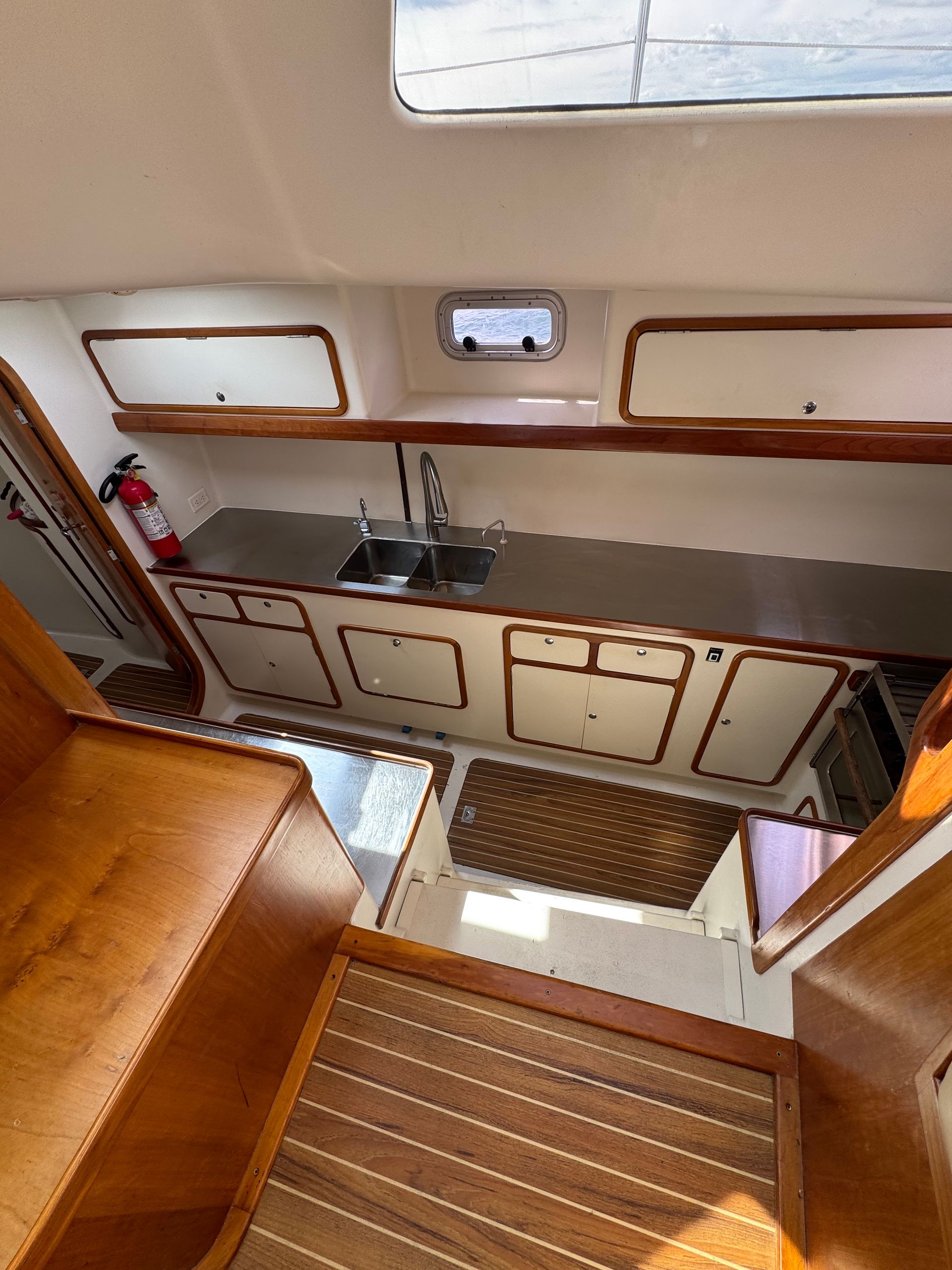 Chris White performance sailing catamaran Atlantic 48 ZEN private listing Rhode Island starboard galley, stainless steel,  ample countertops, double sink, large storage capacity- companionway