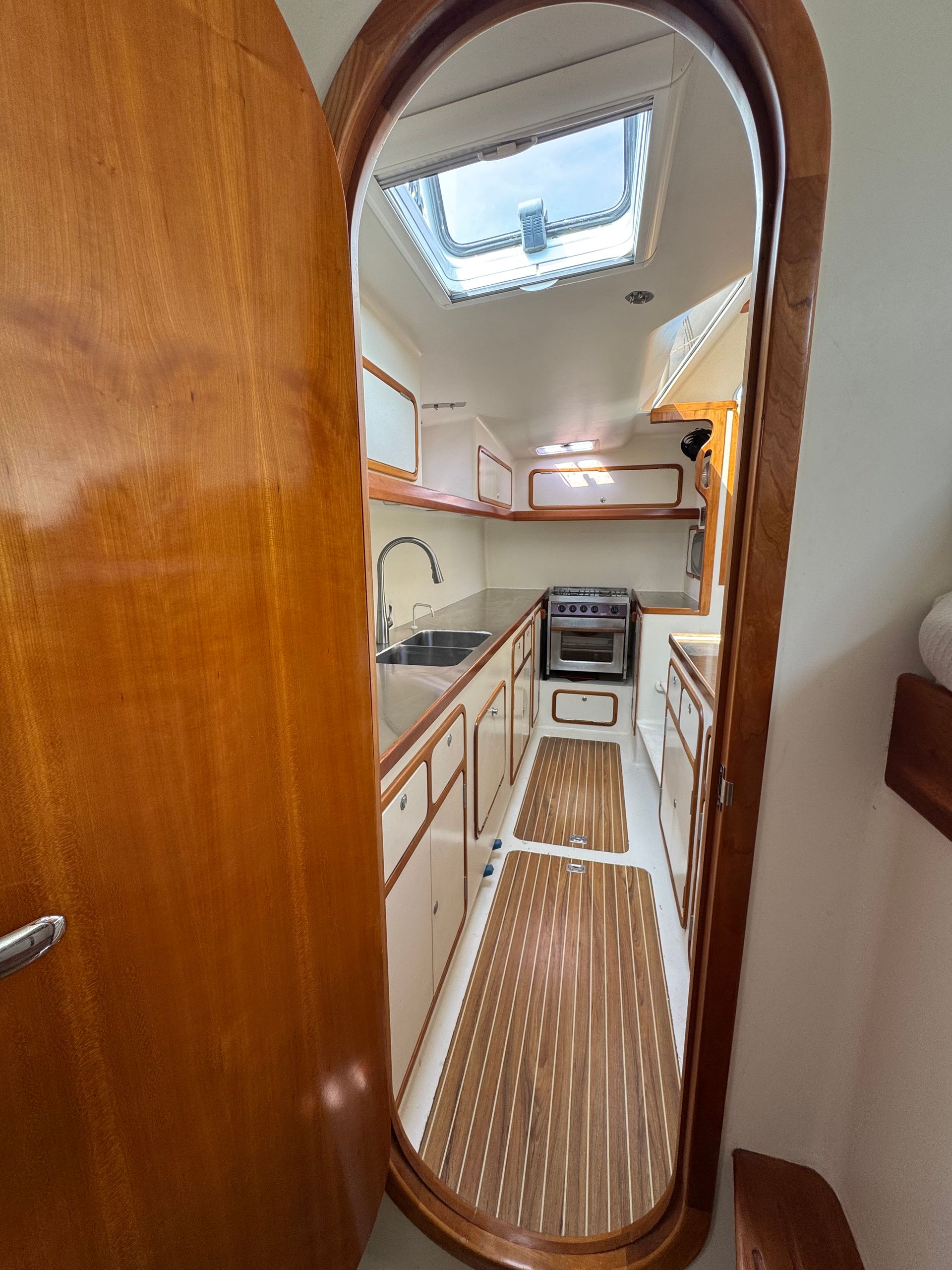 Chris White performance sailing catamaran Atlantic 48 ZEN private listing Rhode Island starboard galley, stainless steel,  ample countertops, double sink, large storage capacity