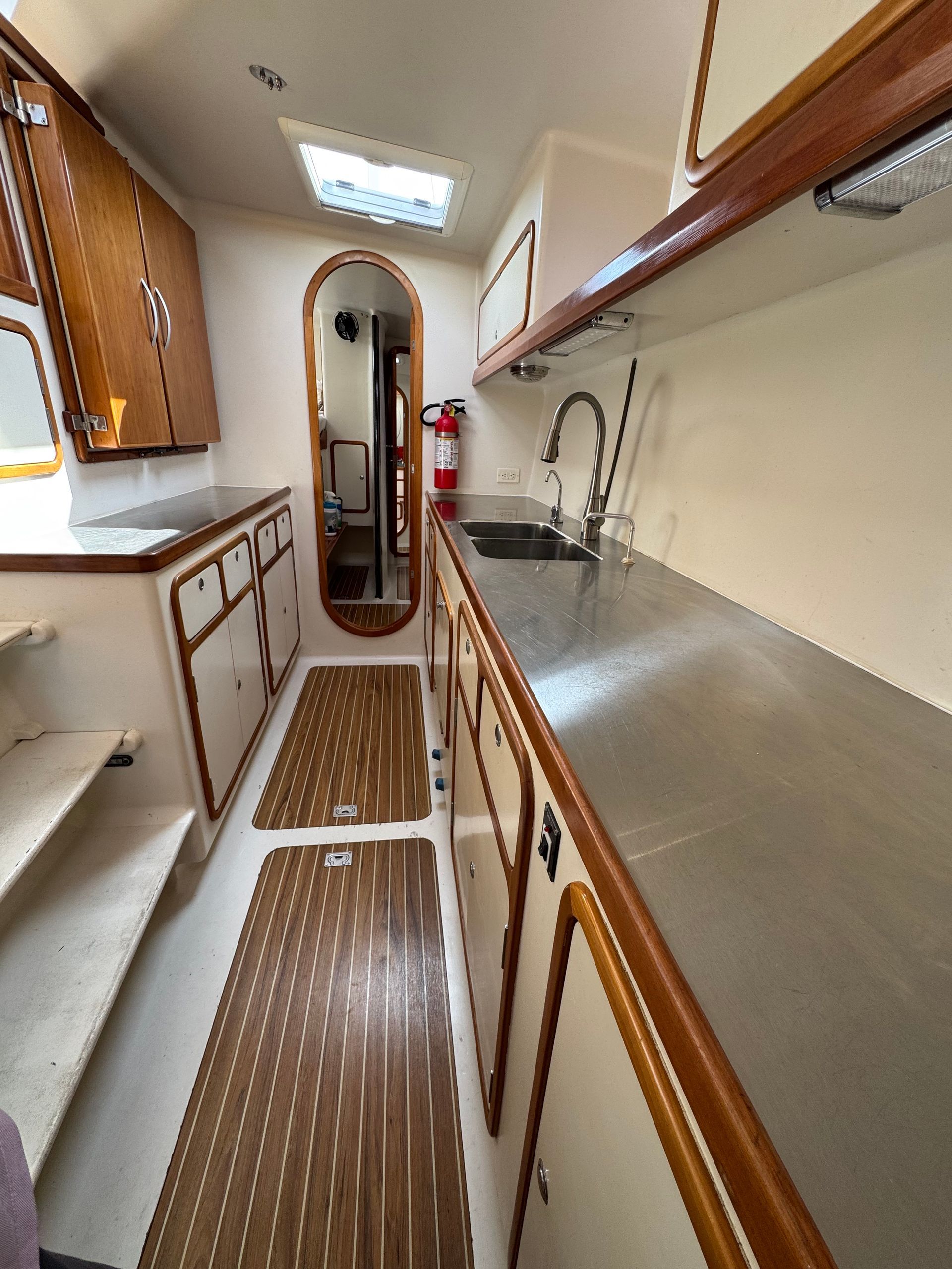 Chris White performance sailing catamaran Atlantic 48 ZEN private listing Rhode Island starboard galley, stainless steel,  ample countertops, double sink, large storage capacity