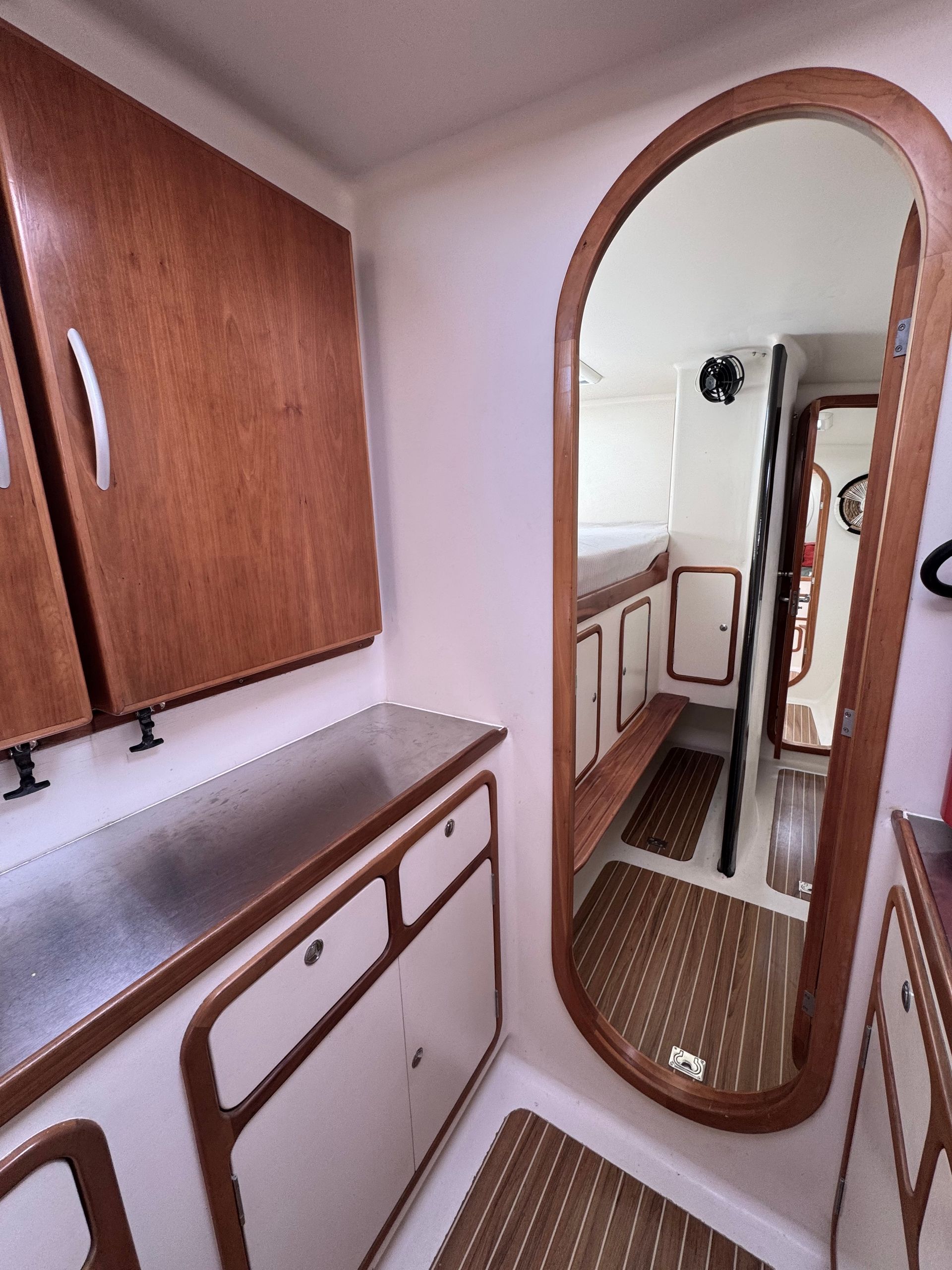 Chris White performance sailing catamaran Atlantic 48 ZEN private listing Rhode Island starboard galley, stainless steel,  ample countertops, double sink, large storage capacity - looking aft to forward