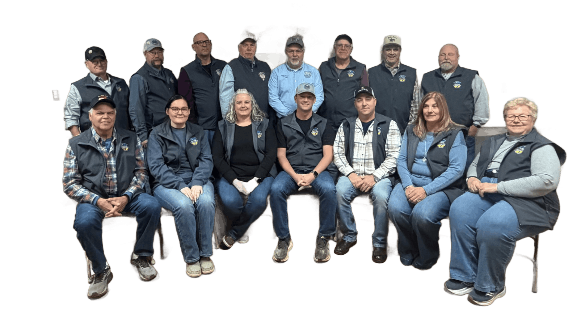 Group of 14 people seated and standing in two rows against a white background, posing for a photo