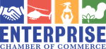 Enterprise Chamber of Commerce logo: handshake, helicopter, monument, cotton boll.