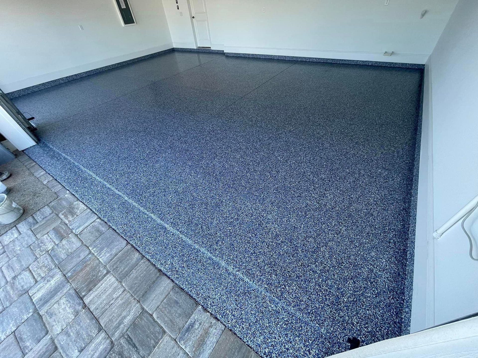 blue epoxy garage flooring installed by Garage Kings  LLC on small square residential garage 