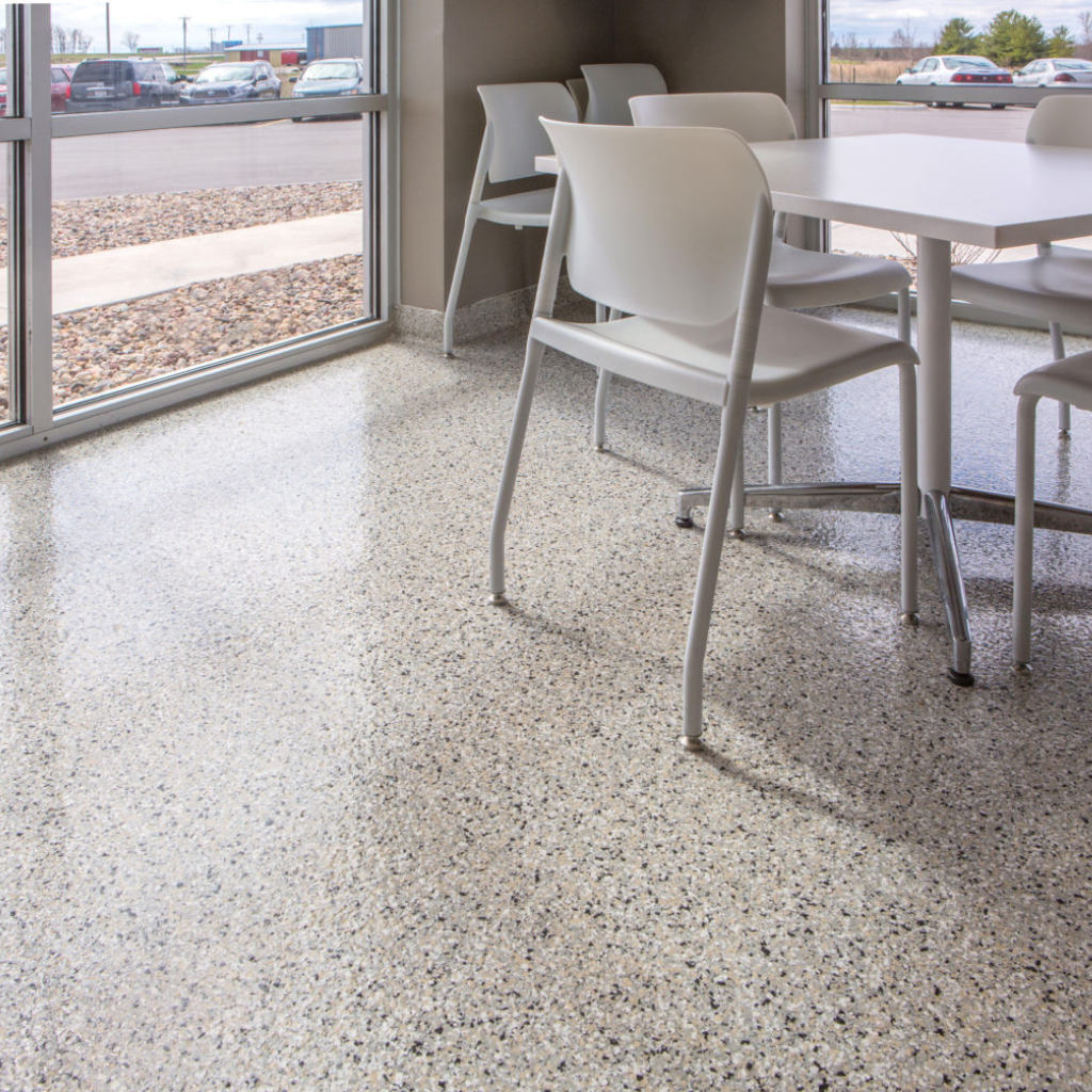 A view of a commercial space with cabin fever concrete coating flakes