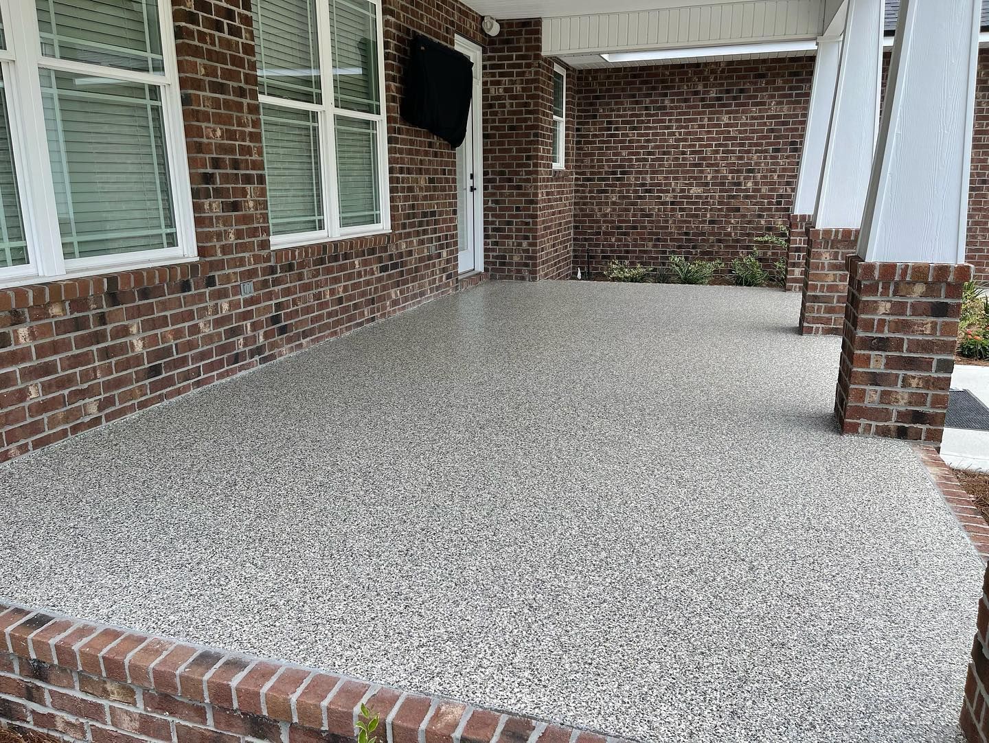 Commercial Epoxy Flooring installation on Jacksonville business front porch 