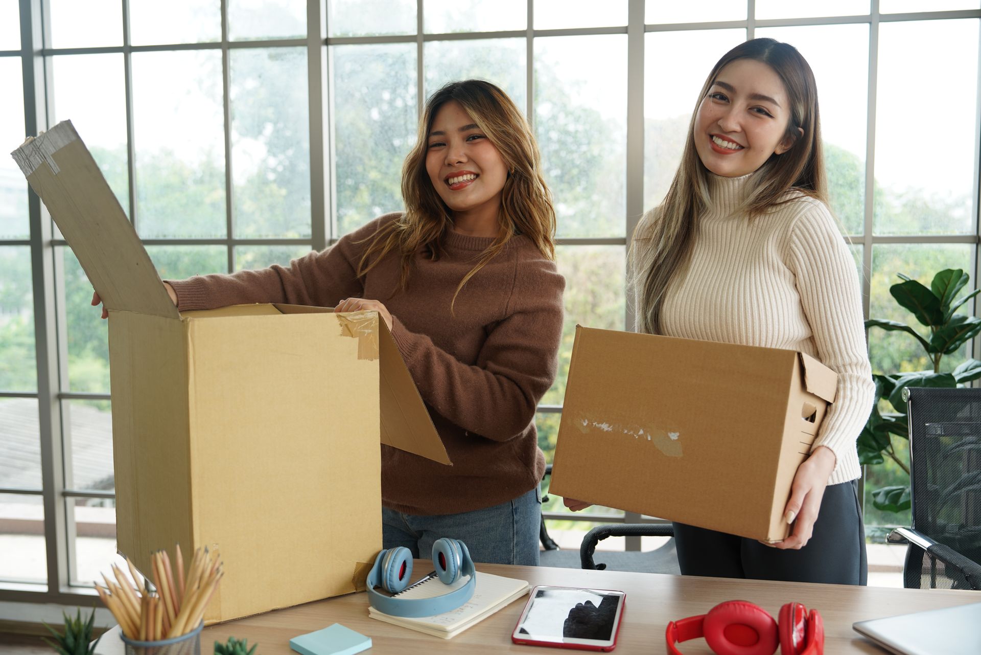 two women moving into office