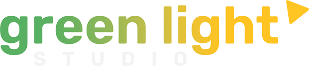 A green light studio logo with a yellow arrow pointing to the right