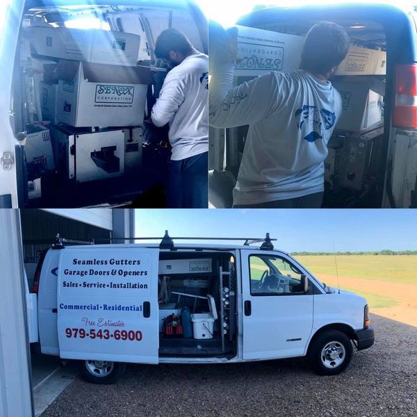 Man loading boxes into a white van, which has 