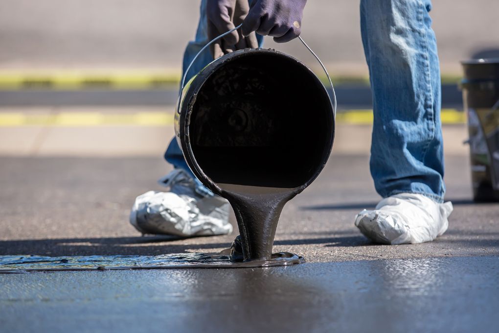 Driveway Coventry pouring sealant onto a driveway