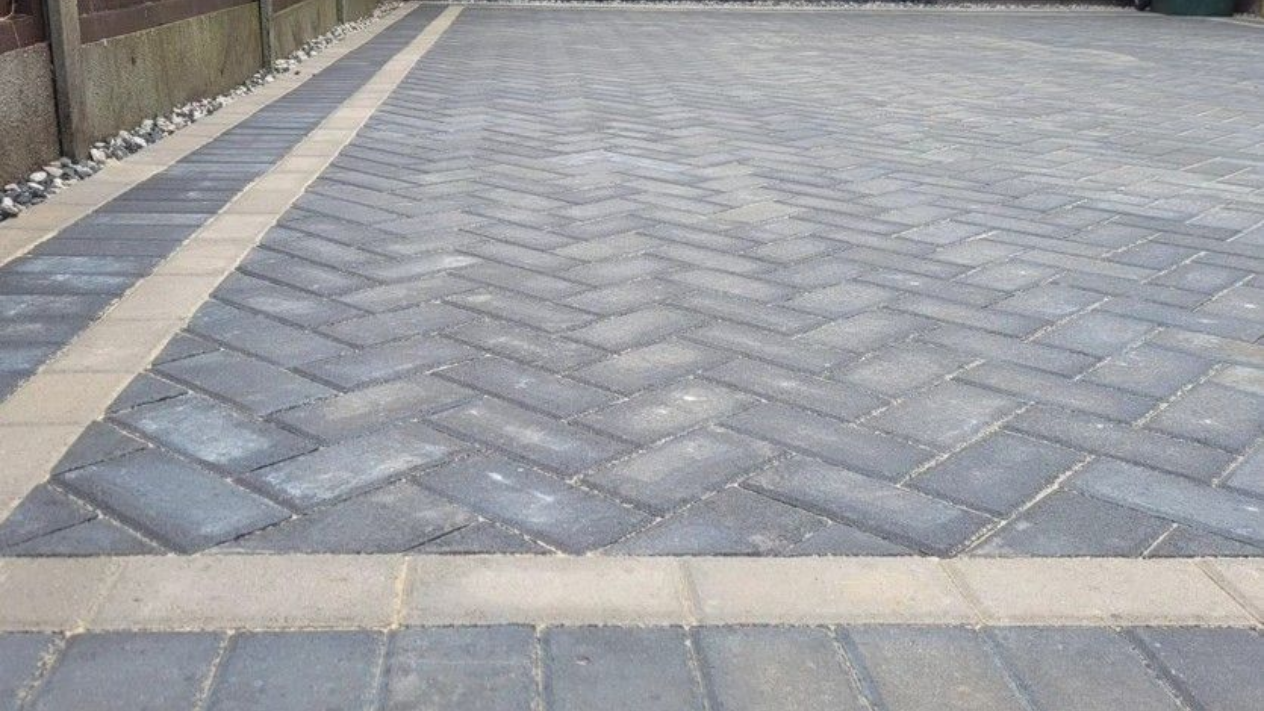 DNA Driveways Coventry - close up of block paving driveway installed in herringbone pattern in Coventry