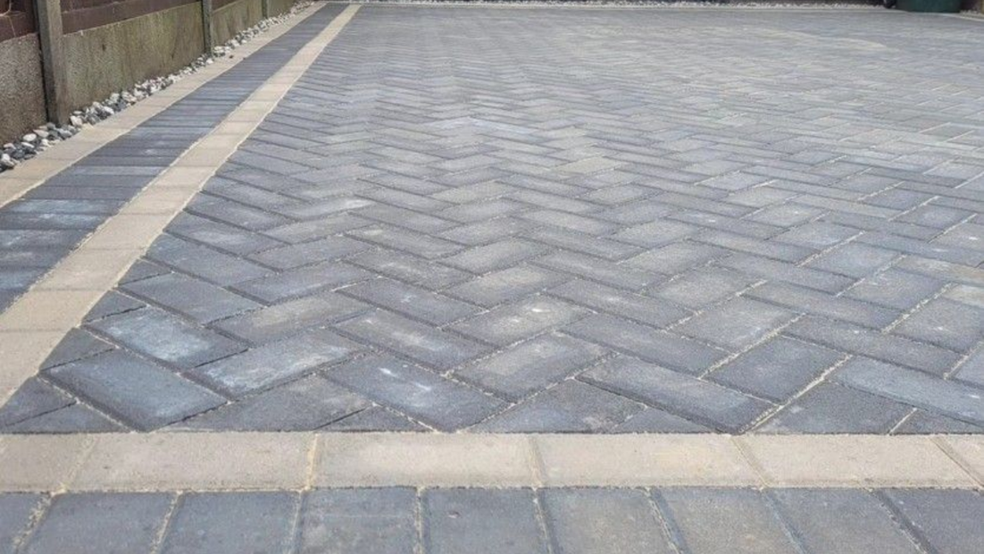 DNA Driveways Coventry - close up of block paving driveway installed in herringbone pattern in Coventry