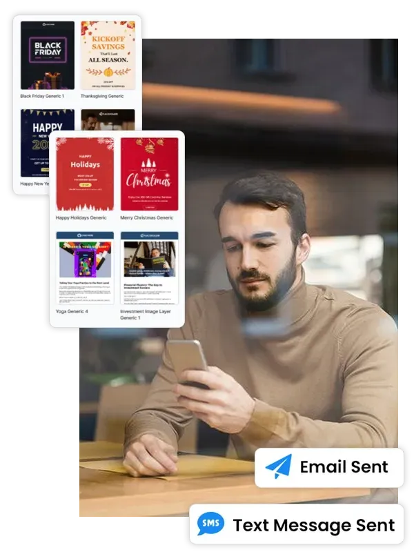 A man is sitting at a table looking at his cell phone.