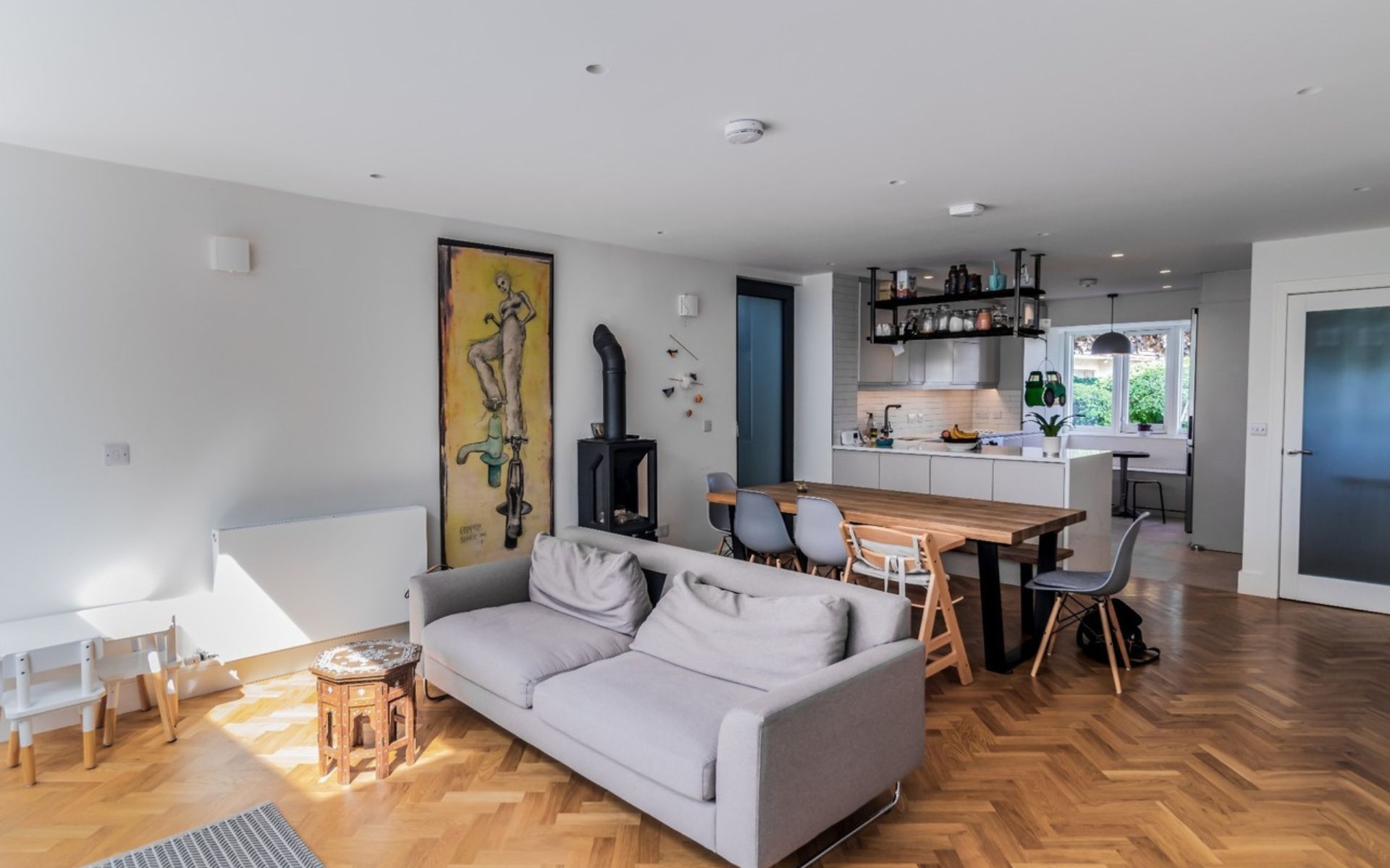 a living room with a couch , table and chairs .