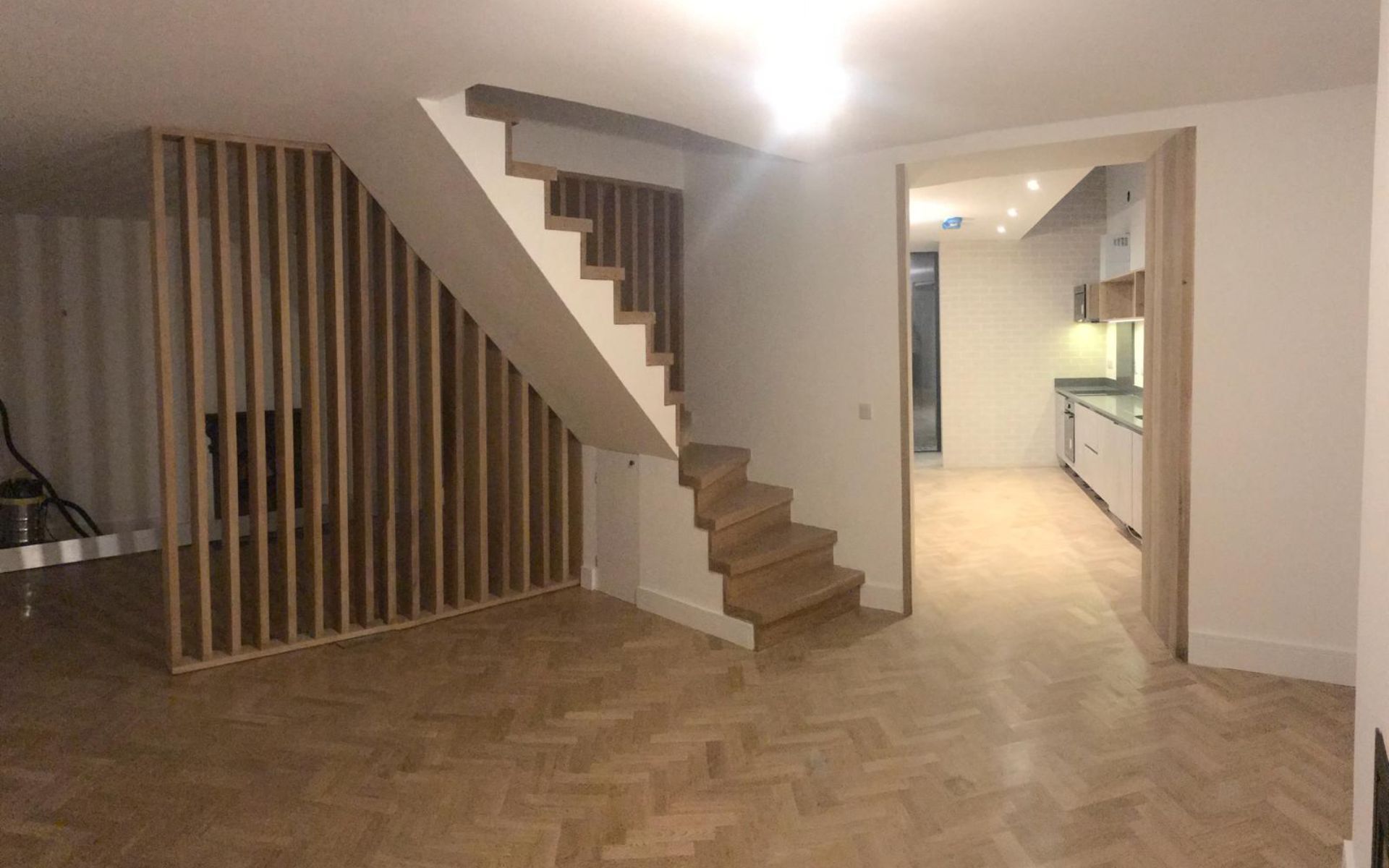 there is a staircase in the middle of the room .
