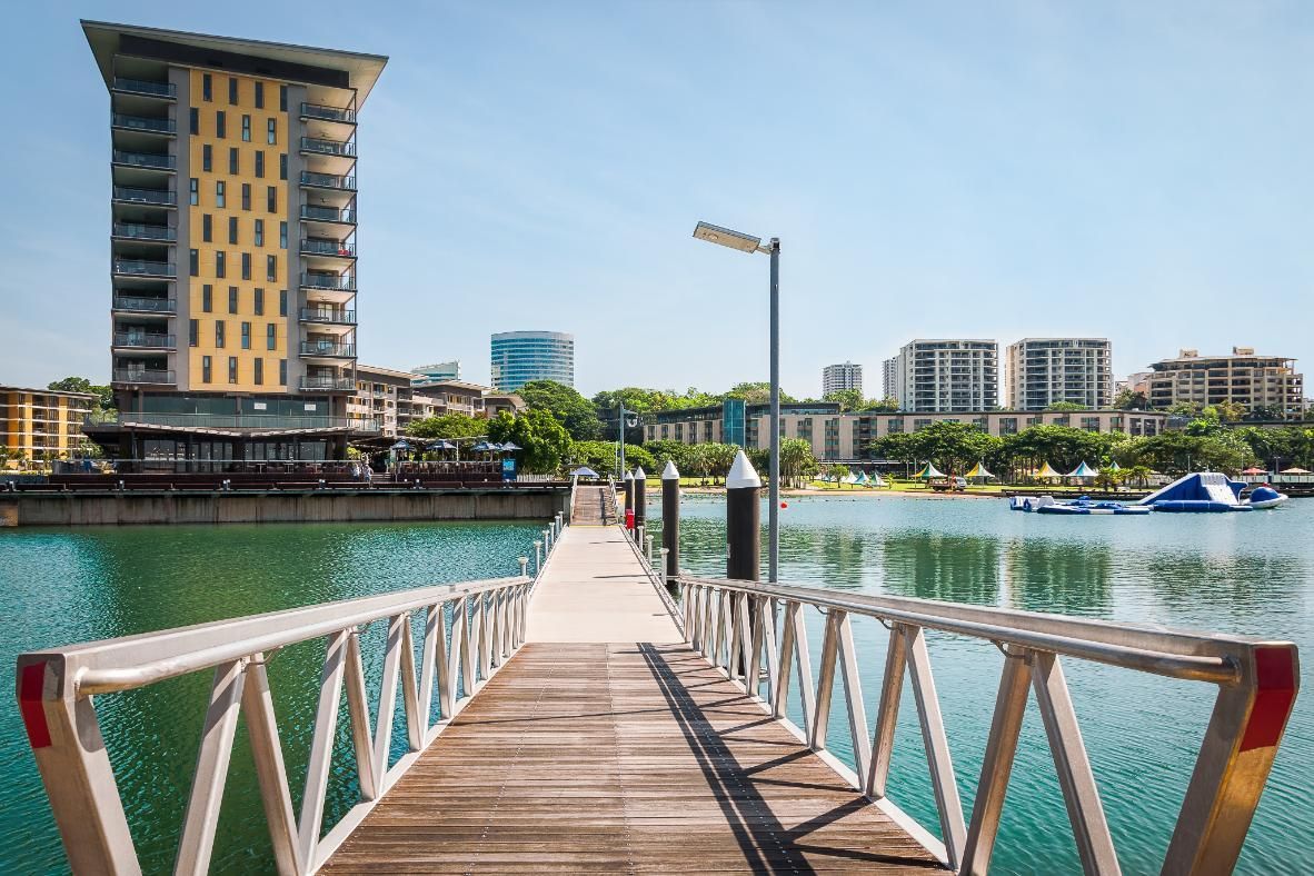 A Bridge And A Body Of Water With A Tall Building In The Background — Chris's Automotive & Marine Electrics In Darwin, NT