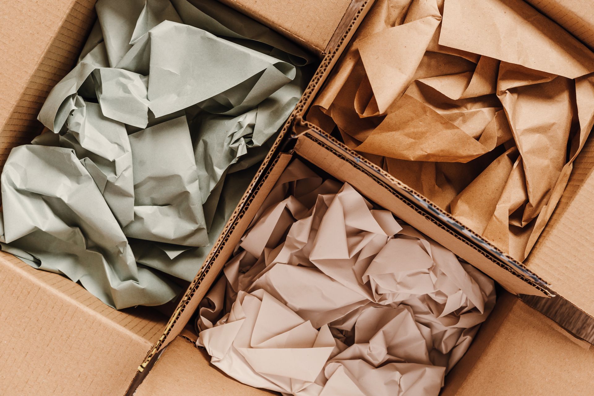 Top view of cardboard boxes filled with crumpled packing paper. Top view of cardboard boxes filled with crumpled packing paper.