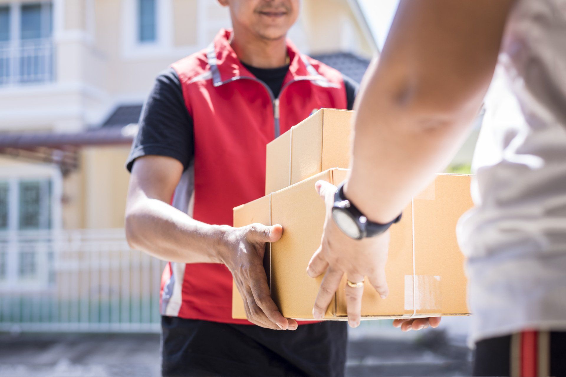 Courier Delivering Boxes — Kansas City, MO — Reliance Paper Co. Courier Delivering Boxes — Kansas City, MO — Reliance Paper Co.