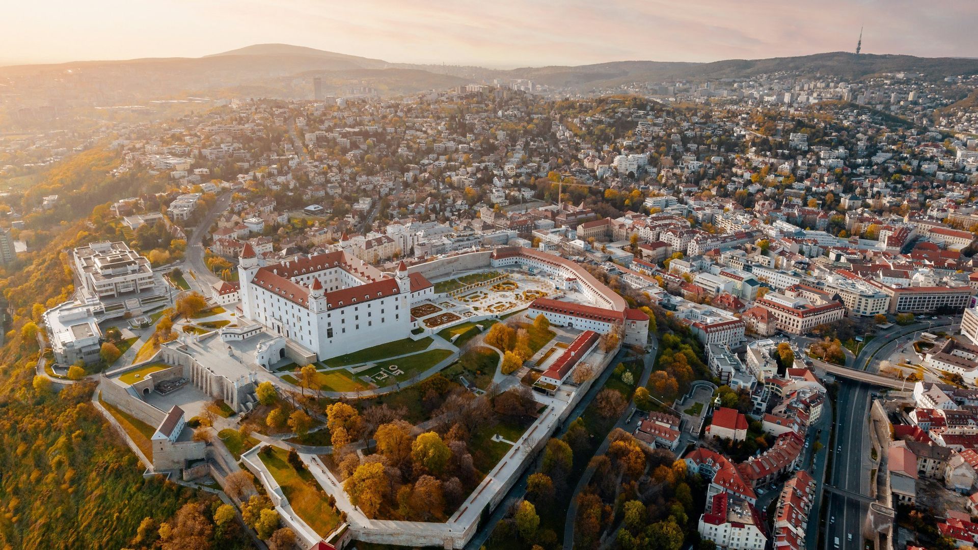 Aerial view of Bratislava Castle and city, Slovakia, during sunset.