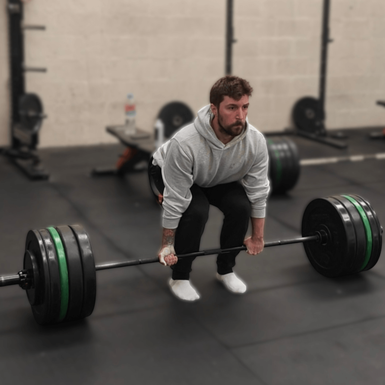 Learn to Lift Bootcamp Glasgow member preparing to deadlift