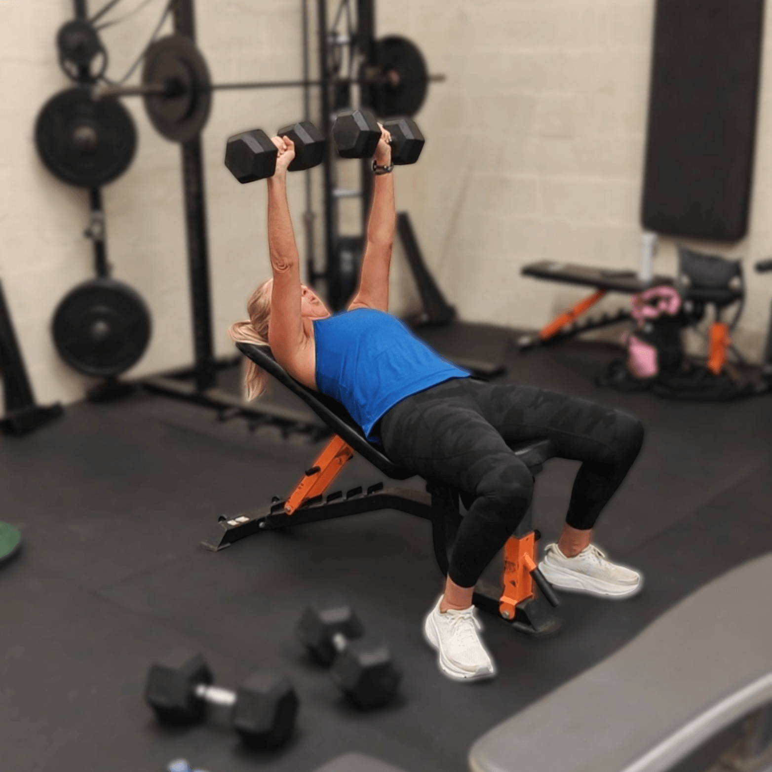 Glasgow Bootcamp session in full swing with woman incline db bench pressing