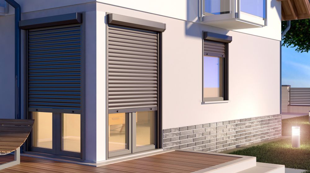 A White House With A Gray Shutter On The Window — Glenn Merrick Constructions In Bowen, QLD