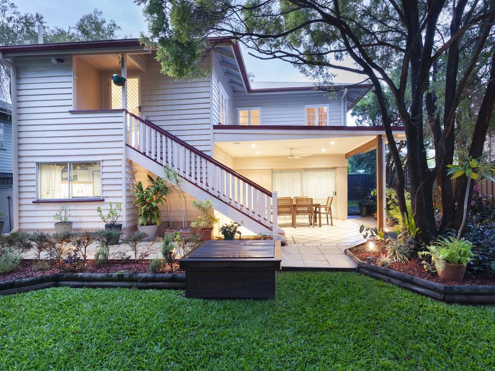 A White House With Stairs Leading Up To The Second Floor — Glenn Merrick Constructions In Bowen, QLD