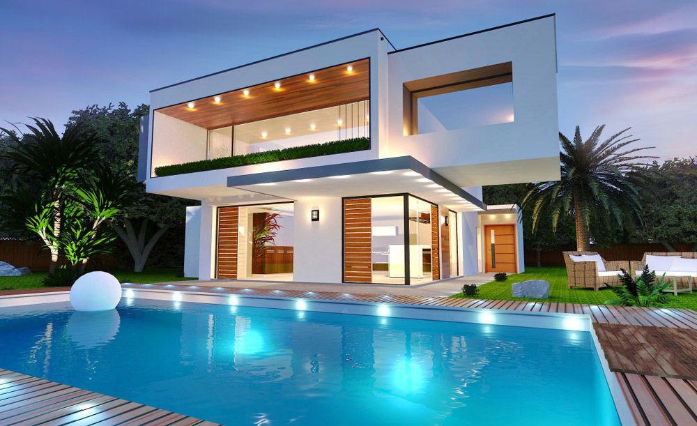 A Modern House With A Swimming Pool In Front Of It — Glenn Merrick Constructions In Whitsundays, QLD