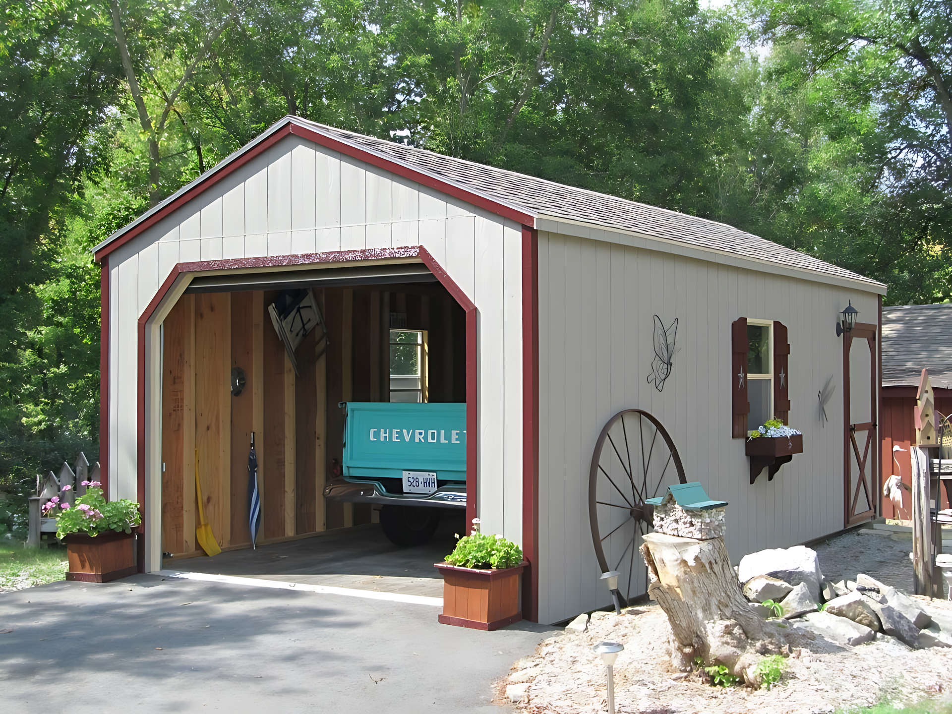 A blue chevy truck is parked in a garage