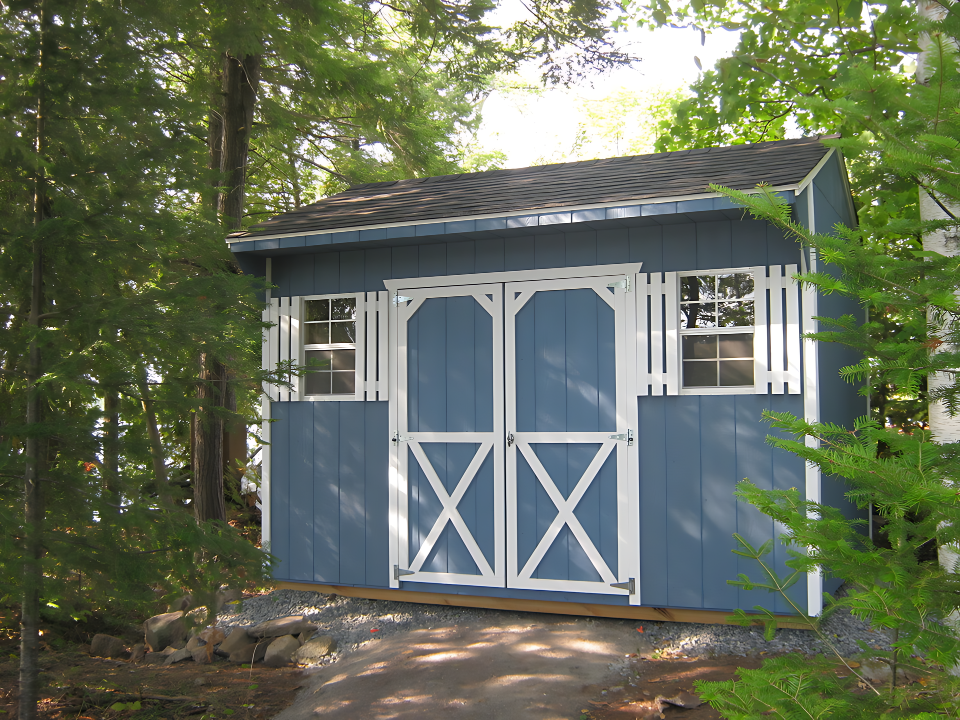A blue shed with a white x on the door