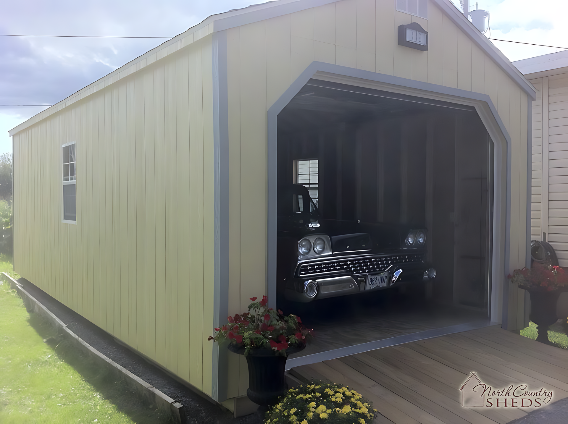 A car is parked in a garage with the door open
