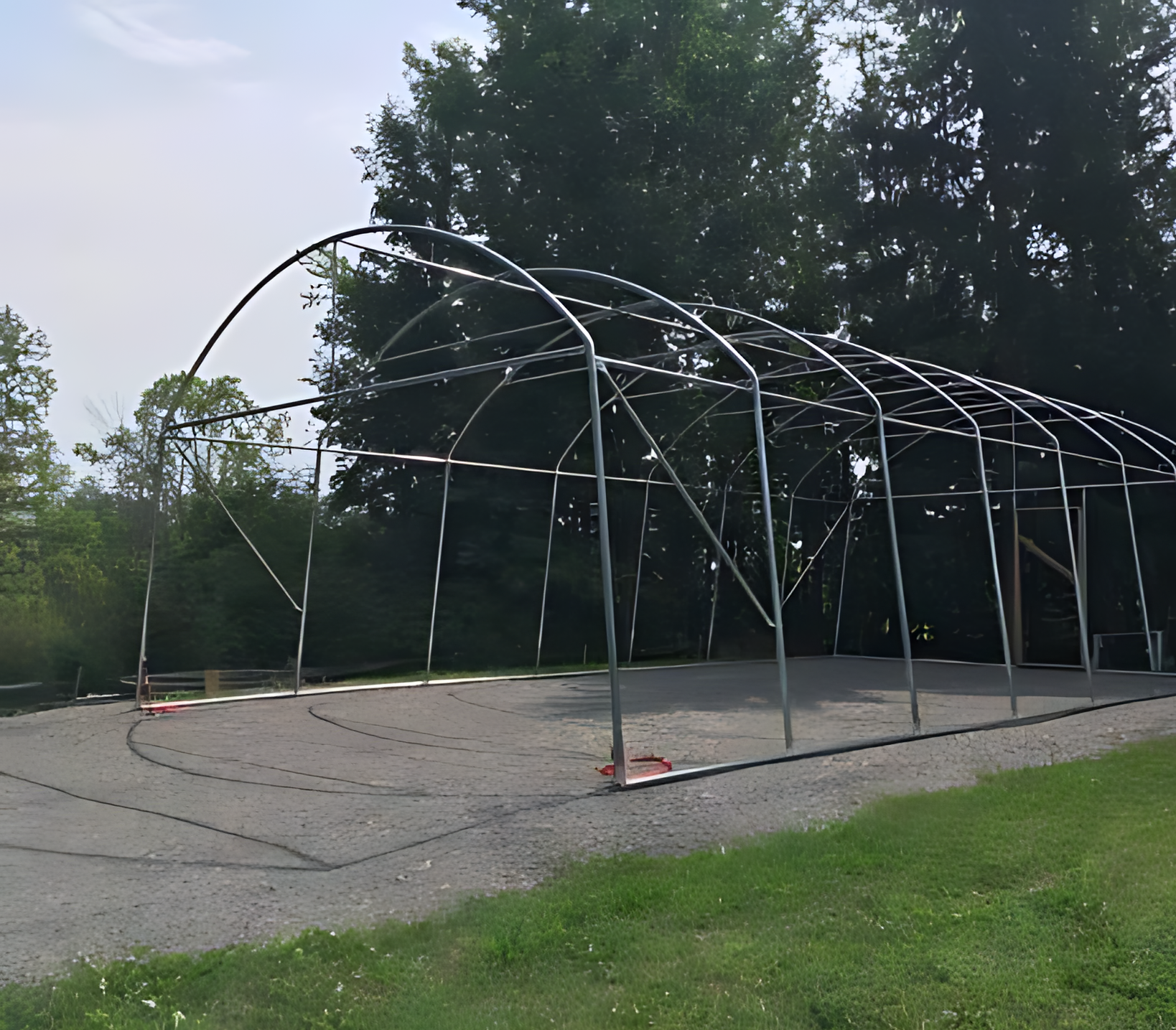 A large metal structure is being built in the middle of a field