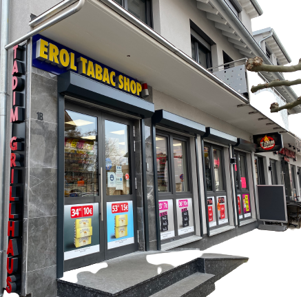 Un bâtiment avec une enseigne indiquant « erol tabac shop »