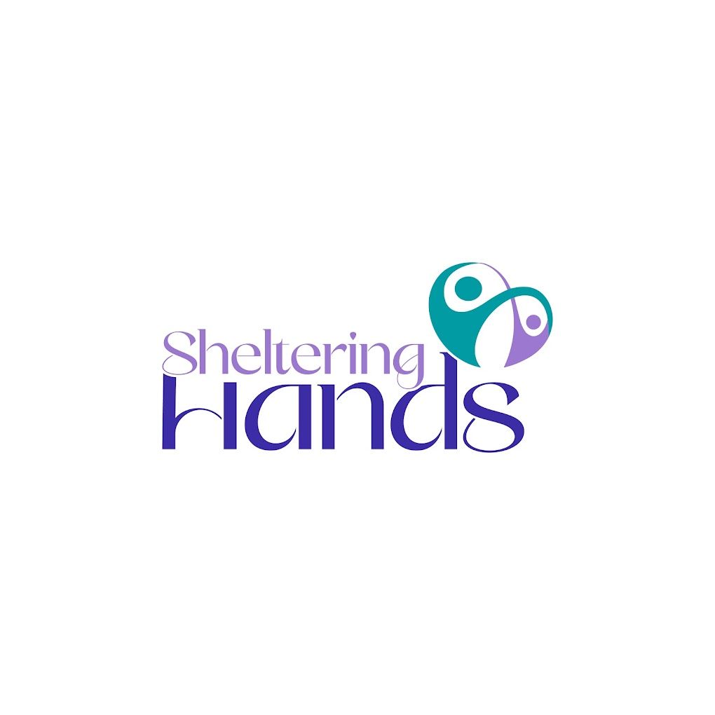 The logo for sheltering hands is purple and blue with a heart in the middle.
