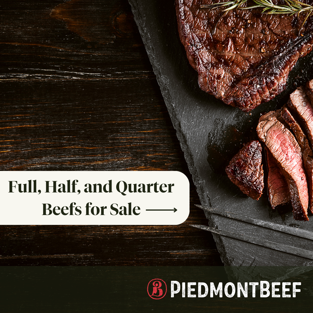 A steak is sitting on a cutting board on a wooden table.